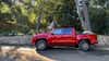 2024 Toyota Tacoma pickup truck first drive: A profile view of a red truck